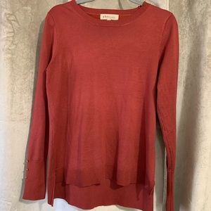 Philosophy sweater in red with gold buttons at the sleeve